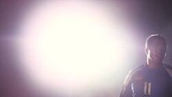 Soccer players compete for the ball as spotlights flood the stadium. Stock Footage