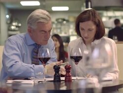 MS PAN Senior man and mature woman drinking wine in restaurant Stock Footage