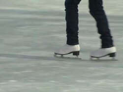 Nymphenburg, ice skates, legs of a woman, frozen river, snow Stock Footage