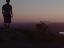 MS PAN Shot of Two men hikiing top of mountain peak in 100 Mile Wilderness of Northern / Maine, United States Stock Footage