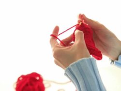 MS Woman Knitting with red wool / Shibuya-ku, Tokyo, Japan Stock Footage