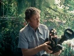 Interview with cameraman Neil Davis about the Vietnam War. 1979 Stock Footage