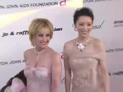 Zhang Jingchu (R) at the 19th Annual Elton John AIDS Foundation Academy Awards Viewing Party at West Hollywood CA. (Footage by WireImage Video/GettyImages) Stock Footage