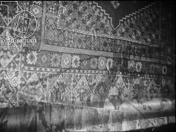 Carpet and leather manufacturing in Morocco, c.1960 - children and women weave carpets, men tan and dry leather Stock Footage