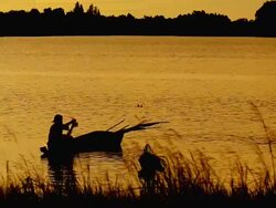 Freshwater fishermen and sunset Stock Footage