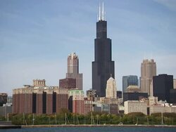 Wide Shot static - Sailboats line Lake Michigan below Willis Tower in Chicago, Illinois. / Chicago, Illinois, USA Stock Footage