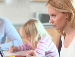 DOLLY: Working mother Stock Footage