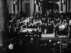 B/W 1963 soldiers + sailors carrying JFK's coffin + putting it on wagon for procession / family background Stock Footage