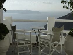 WS Looking through archway at ocean with steep slope on mountain / Fira, Santorini, Greece Stock Footage