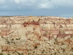 Aerial through canyon system past rock formations in the desert / Southwest USA Stock Footage