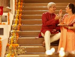 Senior couple eating sweets in diwali festival Stock Footage