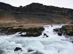 MS Shot of River flowing through farmland  / Iceland  Stock Footage