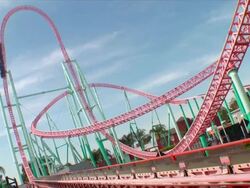Steel rollercoaster climbing its first hill. Point of view shot on the descent Stock Footage