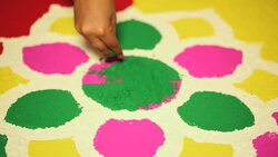 Young woman decorating rangoli in diwali festival, Delhi, India Stock Footage