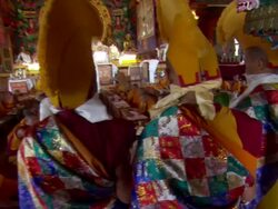 MS ZI Three men wearing ceremonial headdresses standing over other young monks  AUDIO / Kathmandu, Central Region, Nepal  Stock Footage