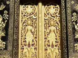 MS Wood carved door with ornaments at Wat Xieng Thong Temple  AUDIO / Luang Prabang, Luang Prabang, Laos Stock Footage