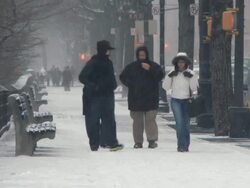 WS People walking in snow on Central Park West / New York City, New York, USA Stock Footage