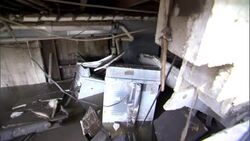 Appliances, athletic equipment and other debris float in a flooded basement. Stock Footage