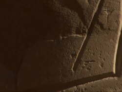 Close Up, pan-right - Detailed petroglyphs are carved in stone / Egypt Stock Footage