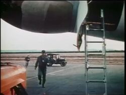 1960s pilots running to ladder to airplane during emergency / Cold War / documentary Stock Footage