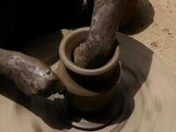 Man making a earthen pot on a pottery wheel  Stock Footage