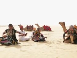 Three women dancing on desert, Sam Desert, Jaisalmer, Rajasthan, India Stock Footage