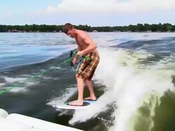 MS view from rear of boat of man wakeboarding/ Texas Stock Footage