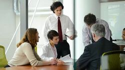 Architect Discusses Blueprints with Doctors and Managers Stock Footage