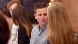 MS Smiling man in discussion with woman during dinner party Stock Footage