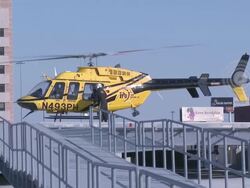 Caucasian doctor coming out from helicopter Stock Footage