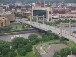 WS Cars passing through bridge over river / Minneapolis, Minnesota, United States  Stock Footage