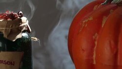 HD Video Of Pumpkin And Poison Bottle In Spooky Atmosphere Stock Footage