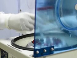 scientist using blood centrifuge. Stock Footage