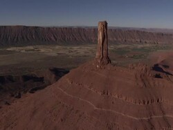 A sandstone pillar tops a mesa in Monument Valley. Stock Footage