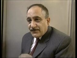 WRAP Iraqis listen/reaction to Blix report, peace activist, journalists News Clip