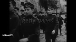 1938: PARIS, FRANCE: Exiled Russian artist conducting group art lesson. RUSSIAN CADET SCHOOL: Young adult males & children in uniforms marching in formation. Male children in chapel, making sign of the Cross before alter. Cadets training w/ swords. Instructional Video