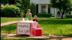 A brother and sister man the lemonade stand in front of their suburban home. Stock Footage