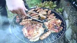 Male hands preparing barbecue food on grill Stock Footage
