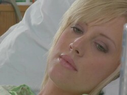Caucasian pregnant woman waiting in hospital bed  Stock Footage