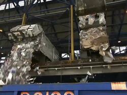 Dump trucks empty paper at a recycling plant. Stock Footage