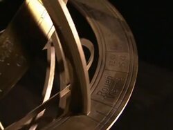 An armillary sphere rotates against a black background. Stock Footage