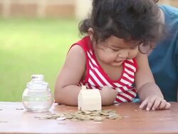 Cute boy with mother learn to count money Stock Footage