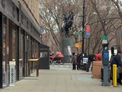 WS People walking on sidewalk, leading up to Central Park during winter / New York City, New York, USA Stock Footage