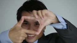 C/U businessman looking through finger frames Stock Footage