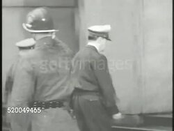 1951: GENERAL DOUGLAS MACARTHUR: JAPAN: ** VS U.S. General Douglas MacArthur exiting vehicle, entering building. VS Various Japanese people reading newspaper about 'MacArthur Replaced.' VS Convoy driving through crowded Japan streets, people cheering. Instructional Video