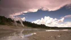 Steam billows from geysers in Yellowstone National Park, Wyoming. Stock Footage