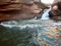 POV of a young man jumping into a river watering hole. - Slow Motion - Model Released - HD Stock Footage