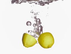 HD Super Slow-Mo: Half Cut Lemons Splashing Into Water Stock Footage