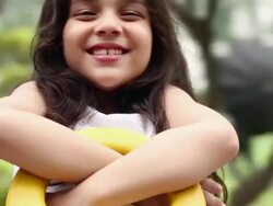 Girl swinging in a Seesaw Stock Footage