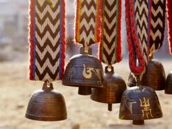 MS Shot of Himalayas livestock and animal bells hang for sale at merchant shop in Namche Bazarre / Namche, Nepal Stock Footage